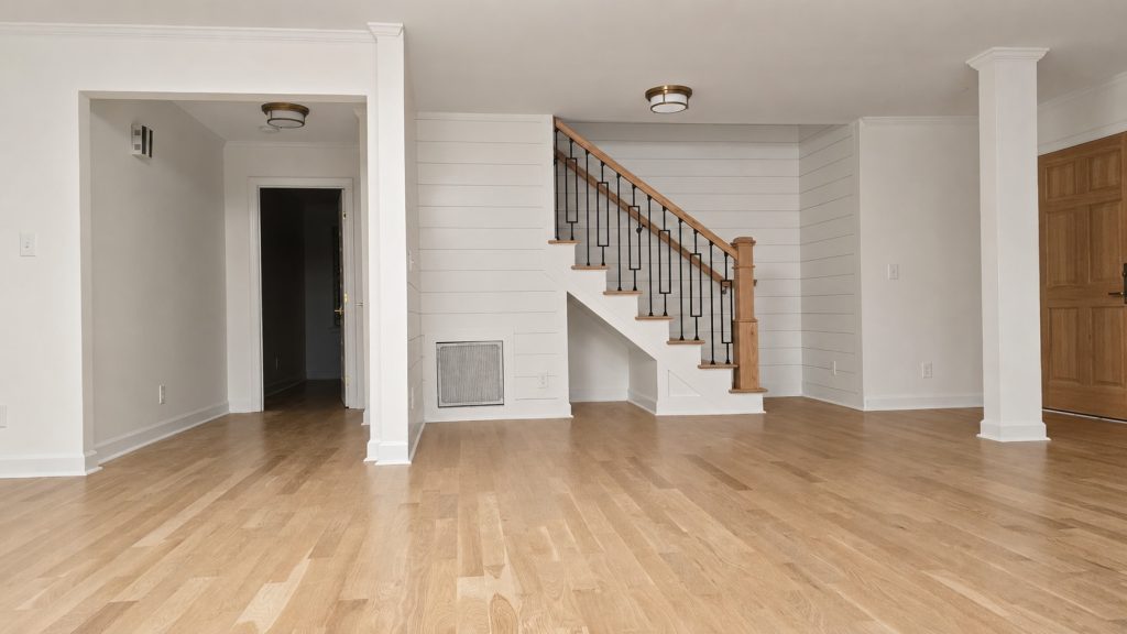 Brightened wood staircase and entryway