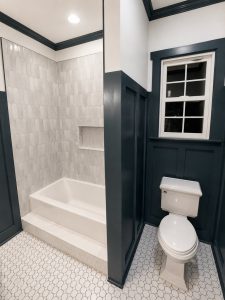 Nighttime Teal and White Bathroom