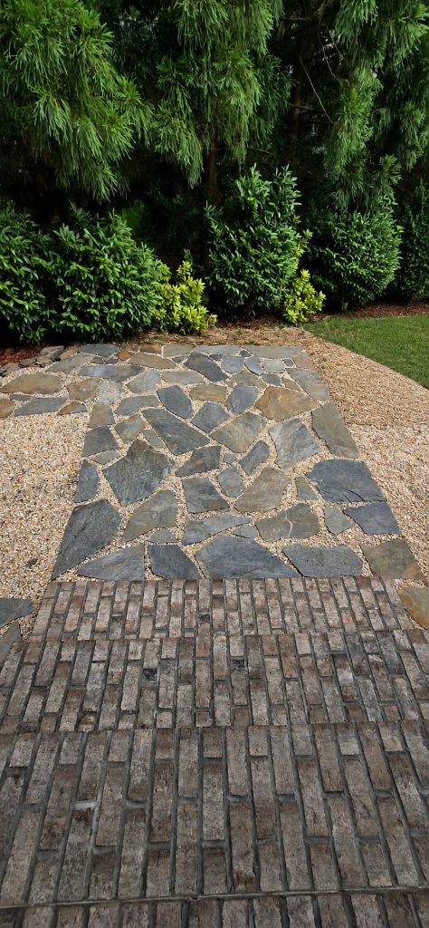 Polished stone patio and lush landscaping