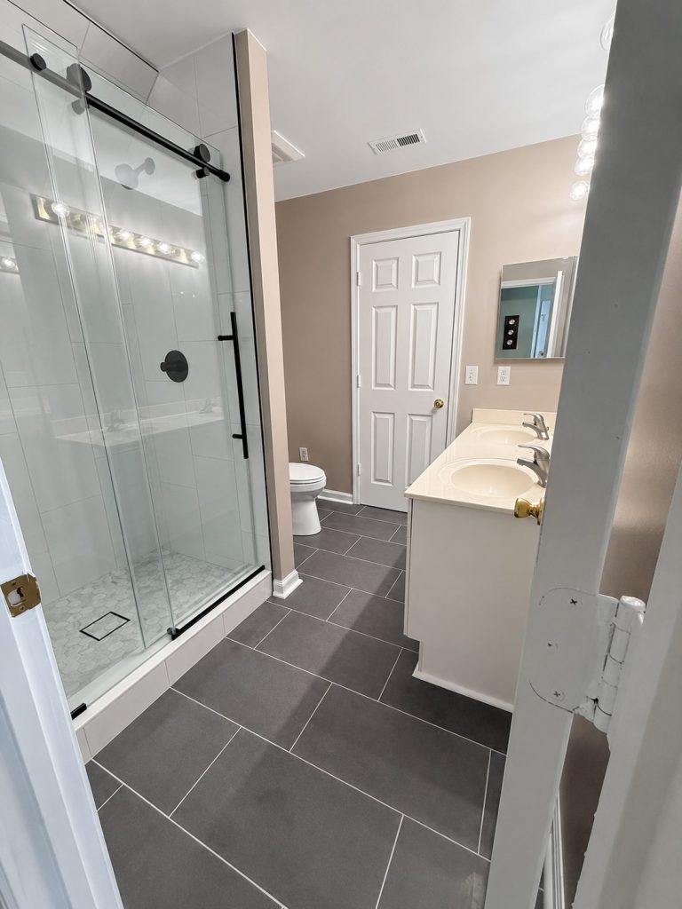 Refined bathroom renovation in balanced light