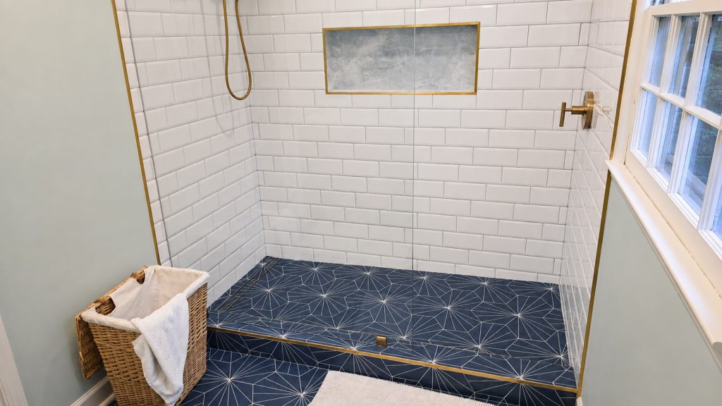 Refined shower with blue geometric tile