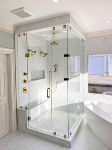 Sunlit Marble Bathroom with Brass Fixtures