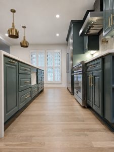Symmetrical finished green kitchen aisle