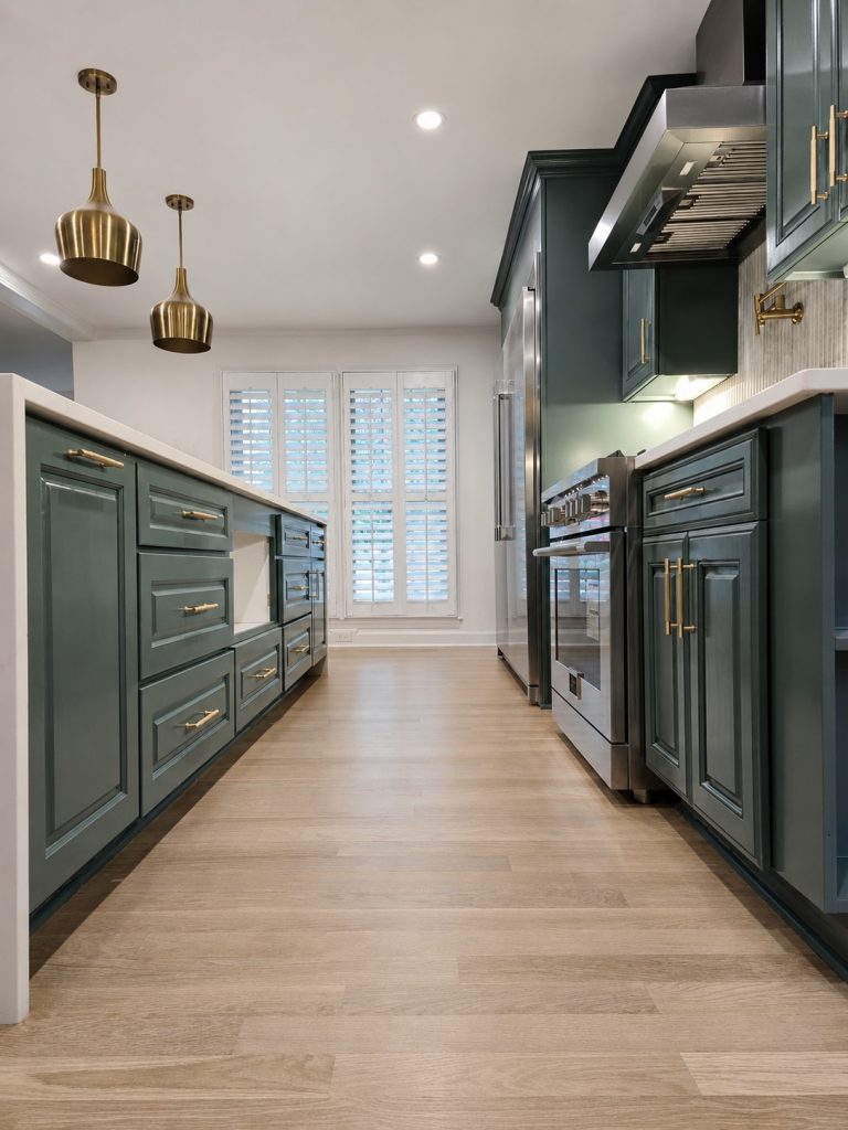Symmetrical finished green kitchen aisle